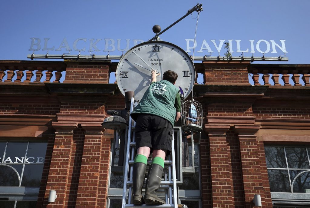 Daylight saving time. ZSL London Zoo trainee keeper Jasmine Sinclair make adjustments to the Bird Clock, created by Tim Hunkin, which stands outside the Blackburn Pavillion at ZSL London Zoo in Regent's Park, London, ahead of this weekends daylight saving time. Picture date: Friday March 29, 2019. See PA story SOCIAL Clock. Photo credit should read: Jonathan Brady/PA Wire URN:42049163 (Press Association via AP Images)