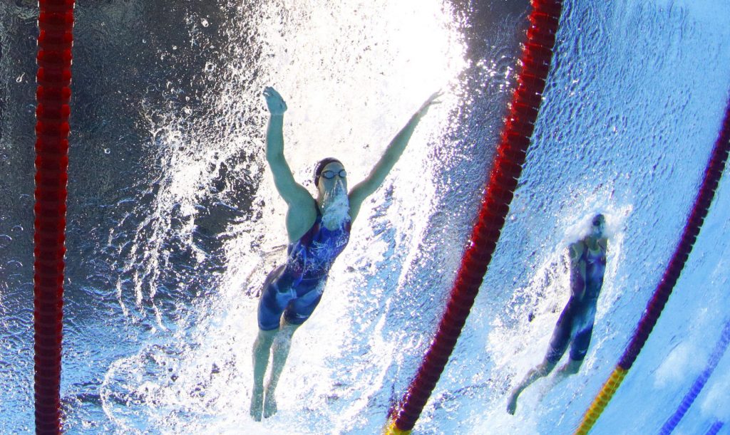 flickinger_underwater-1920×1146 Hali Flickinger, left, of Spring Grove, York County, competes for the U.S. in a semifinal of the women's 200-meter butterfly at the Summer Olympics in Rio de Janeiro, Brazil. Flickinger placed seventh in the event’s final heat. (David J. Phillip/AP Photo)