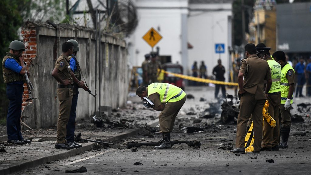 Sri Lankan security personnel inspect the debris of a van after it explodes on Monday near St. Anthony’s Shrine in Colombo. Nearly 300 people died and more than 500 others were wounded after Sunday’s attacks on churches and hotels. Sri Lankan security personnel inspect the debris of a van after it explodes on Monday near St. Anthony's Shrine in Colombo. Nearly 300 people died and more than 500 others were wounded after Sunday's attacks on churches and hotels. (Jewel Samad/AFP/Getty Images)