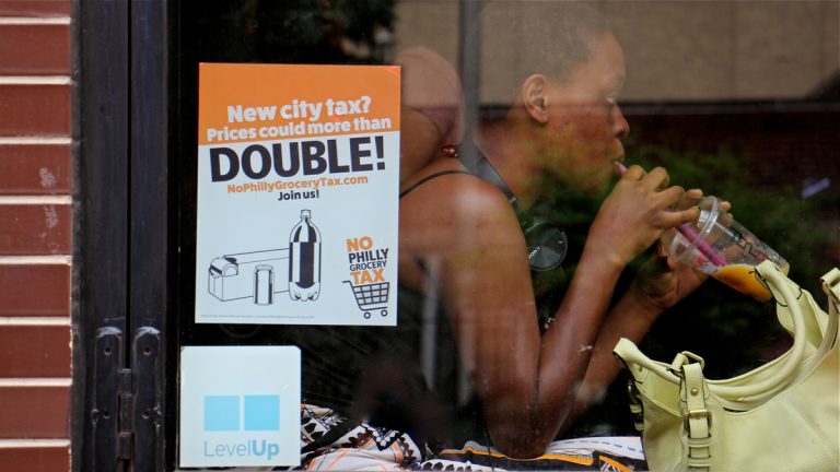 A customer enjoys a bubble tea at TeaDo in Philadelphia's Chinatown neighborhood. (Emma Lee/WHYY)