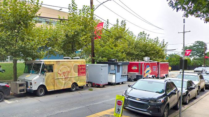 Food trucks lined up in their regular spots at Temple (Google Street View/Billy Penn) 