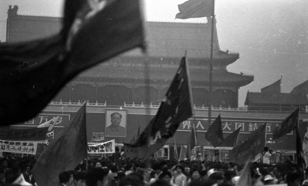 Protesters wave flags on Beijing’s Tiananmen Square in the weeks leading up to the violent crackdowns on June 4. These photos were donated to Humanitarian China by the photographer, Jian Liu, then one of the student protesters. Protesters wave flags on Beijing's Tiananmen Square in the weeks leading up to the violent crackdowns on June 4. These photos were donated to Humanitarian China by the photographer, Jian Liu, then one of the student protesters. (Jian Liu/Humanitarian China)