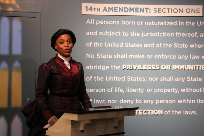 An actress portraying Frances Ellen Watkins Harper, a key African American figure from the Reconstruction era, delivers an address that Harper delivered in Philadelphia, 
