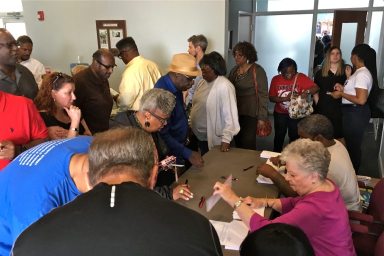 Ward leaders line up for their checks at Democratic City Committee headquarters. (Dave Davies/WHYY)