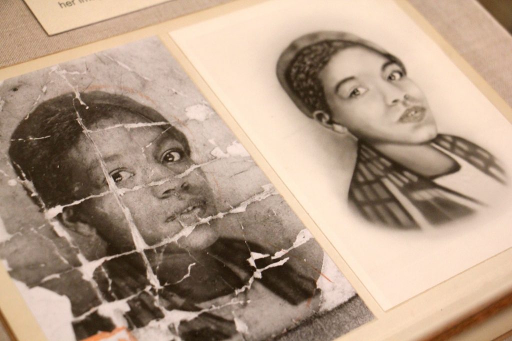 2019 05 23-e lee-philadelphia library company-past afro futurism A photo of an unidentified young African American woman is deeply creased as if it were folded and carried around by someone who valued it. It is part of an exhibit at the Library Company of Philadelphia called