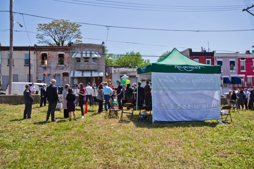 2019 05 6 bess family temple police-4 Philabundance employees and government officials ceremonially break ground at the site of a new community kitchen on north 10th Street. (Kimberly Paynter/WHYY)