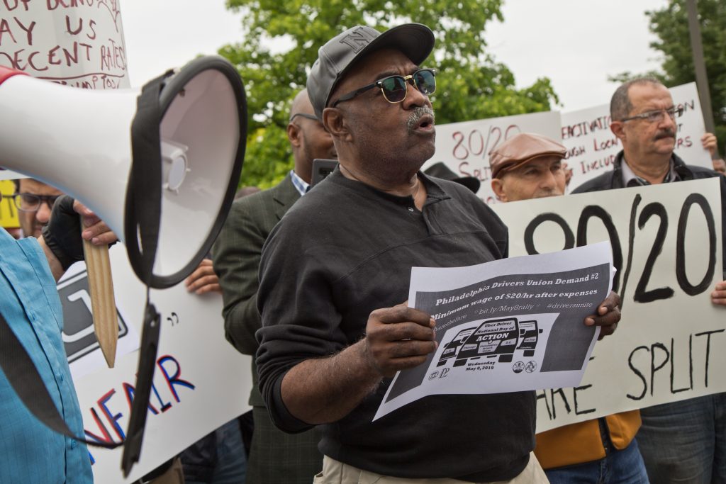 Driver Kevin Myers protests outside Uber’s Philadelphia headquarters Wednesday. (Kimberly Paynter/WHYY)