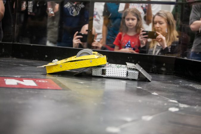 Pre-Swiss Cheese, a robot fielded by Upper Bucks County Technical School competes against MaST Community Charter School's robot Mcnasty during the Liberty Bots competiton Saturday at Montgomery County Community College. (Brad Larrison for WHYY)