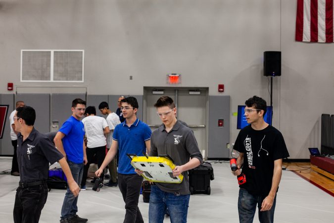 Students from Upper Bucks County Technical School carry their robot Pre-Swiss Cheese to the 