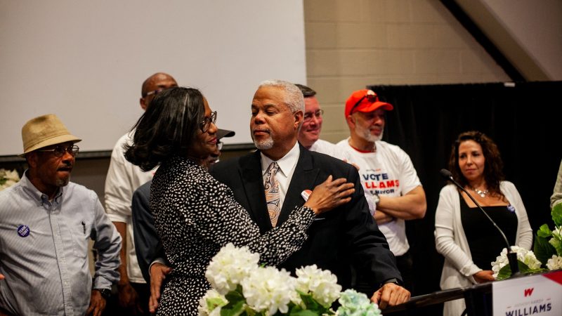 Democratic mayoral candidate Anthony Hardy Williams hugs his wife Shari after addressing supporters and conceding to incumbent Mayor Jim Kenney Tuesday evening. (Brad Larrison for WHYY)