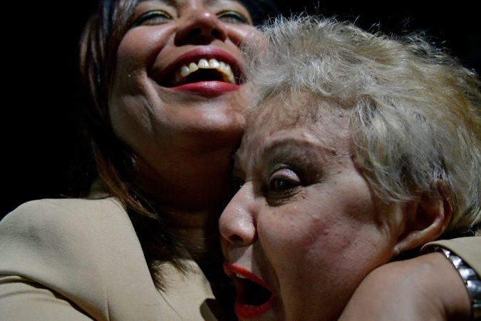 Bienvebita Neris receives a hug from her daughter Maria Quiñones-Sanchez as the councilwomen celebrates the victory over state Rep. Ángel Cruz in the race in the 7th Councilmanic district. (Bastiaan Slabbers for WHYY)