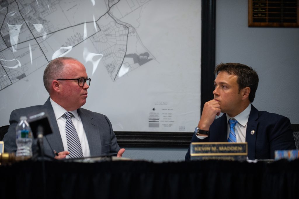20190529_WHYY_Delco Council Meeting_D4_016x2 Delaware County council chairman John McBlain and council member Kevin Madden discuss a proposed measure on new ethics requirements at the Thornberry Township building in Cheyney, Pa. on Wednesday, May 29, 2019. (Kriston Jae Bethel for WHYY)