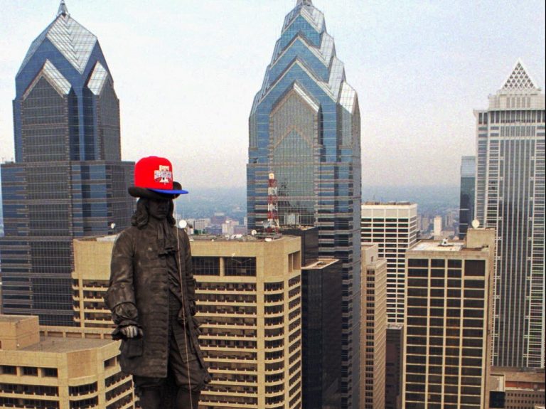 The Alexander Milne Calder statue of William Penn wears an All Star Game ball cap after it's installation early Friday morning, June 28, 1996, high over Philadelphia's City Hall. The 100-pound cap, 7 feet long and 4 feet high, was raised in preparation for the game to be played July 9. (AP Photo/ George Widman)