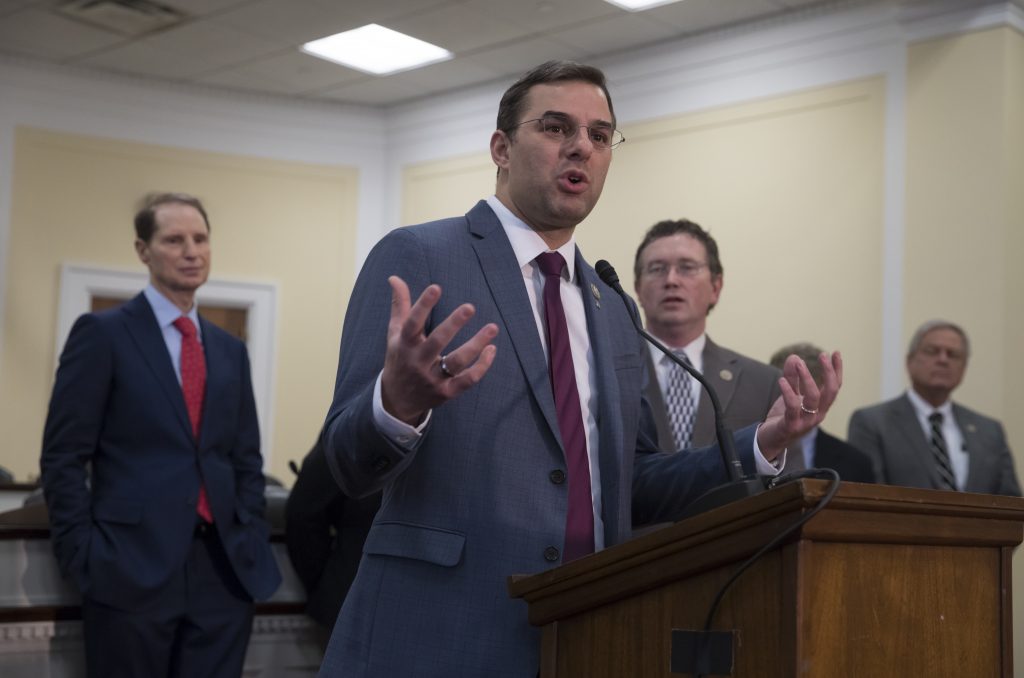Rep. Justin Amash, R-Mich., (center), is joined by, (from left), Sen. Ron Wyden, D-Ore., Rep. Thomas Massie, R-Ky., and Rep. Ralph Norman, R-S.C., as he hosts a news conference with a bipartisan group of House and Senate lawmakers who are demanding the U.S. government should be required to seek warrants if it wants to search for information about Americans and insist on reforms to the FISA Amendments Reauthorization Act of 2017 to protect Americans' rights, at the Capitol in Washington, Wednesday, Jan. 10, 2018. (J. Scott Applewhite/AP Photo)