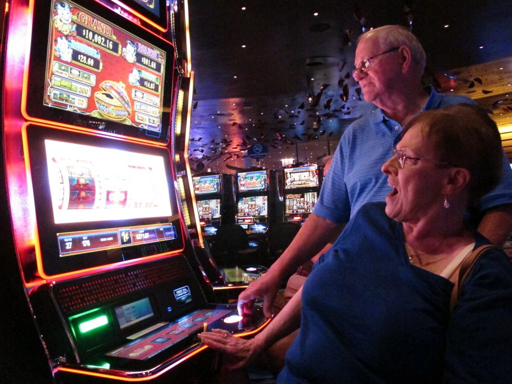 Ocean Resort Casino In this June 25, 2018 photo, Joyce Green of Vineland, N.J. reacts to a winning spin at a slot machine as her husband Tom looks on inside the Ocean Casino Resort in Atlantic City, N.J. The casino formerly known as Revel will turn a profit in May after months of steep losses. (Wayne Parry/AP Photo)