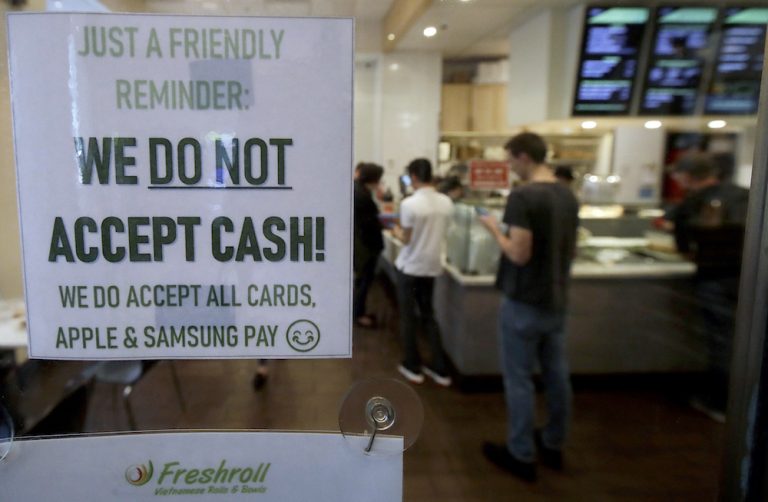 Two Democrats in Congress have introduced bills that would bar brick-and-mortar businesses nationwide from rejecting cash. (Jeff Chiu/AP Photo)