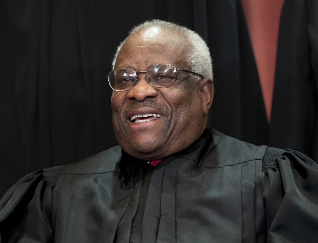 Clarence Thomas In this Nov. 30, 2018, file photo, Supreme Court Associate Justice Clarence Thomas, appointed by President George H. W. Bush, sits with fellow Supreme Court justices for a group portrait at the Supreme Court Building in Washington. Thomas is now the longest-serving member of a court that has recently gotten more conservative, putting him in a unique and potentially powerful position, and he’s said he isn’t going away anytime soon. (J. Scott Applewhite/AP Photo, File)