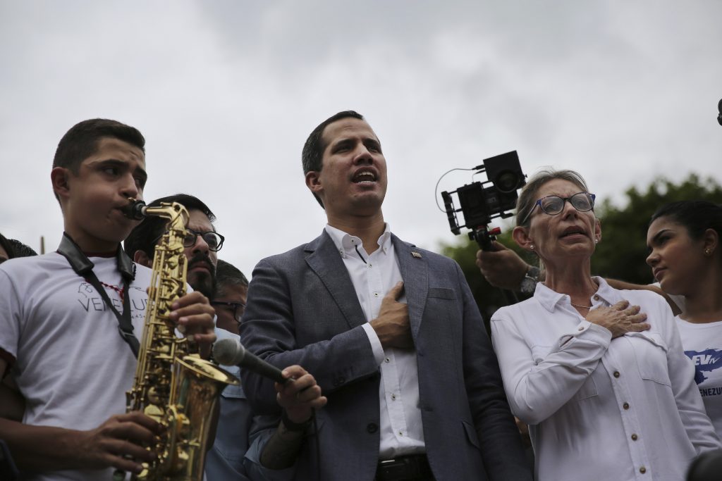 Juan Guaidó, Olivia Lozano Opposition leader Juan Guaidó and congresswoman Olivia Lozano join in the singing of the national anthem during a rally in Caracas, Venezuela, Saturday, May 11, 2019. Guaidó has called for nationwide marches protesting the Maduro government, demanding new elections and the release of jailed opposition lawmakers. (Rodrigo Abd/AP Photo)