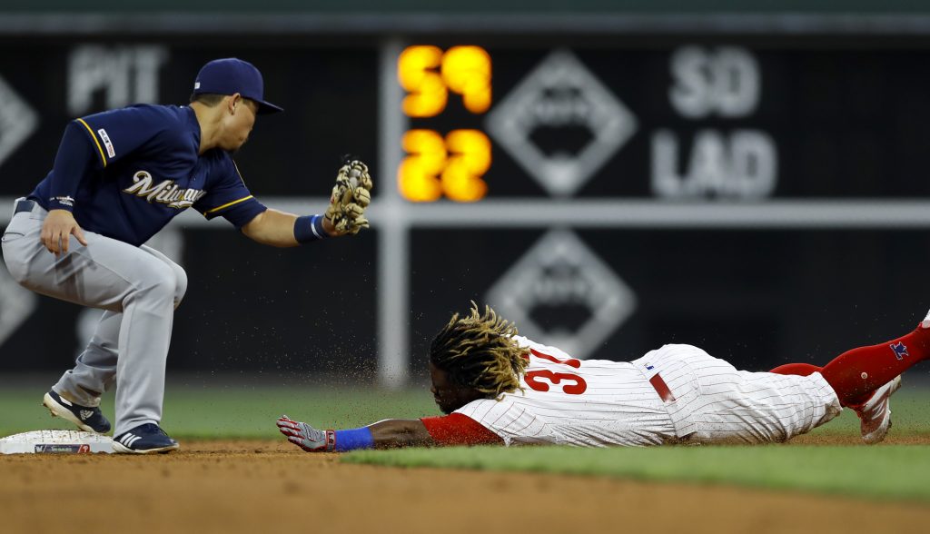 Odubel Herrera, Keston Hiura Philadelphia Phillies' Odubel Herrera, right, steals second base past Milwaukee Brewers second baseman Keston Hiura during the second inning of a baseball game, Tuesday, May 14, 2019, in Philadelphia. (AP Photo/Matt Slocum)