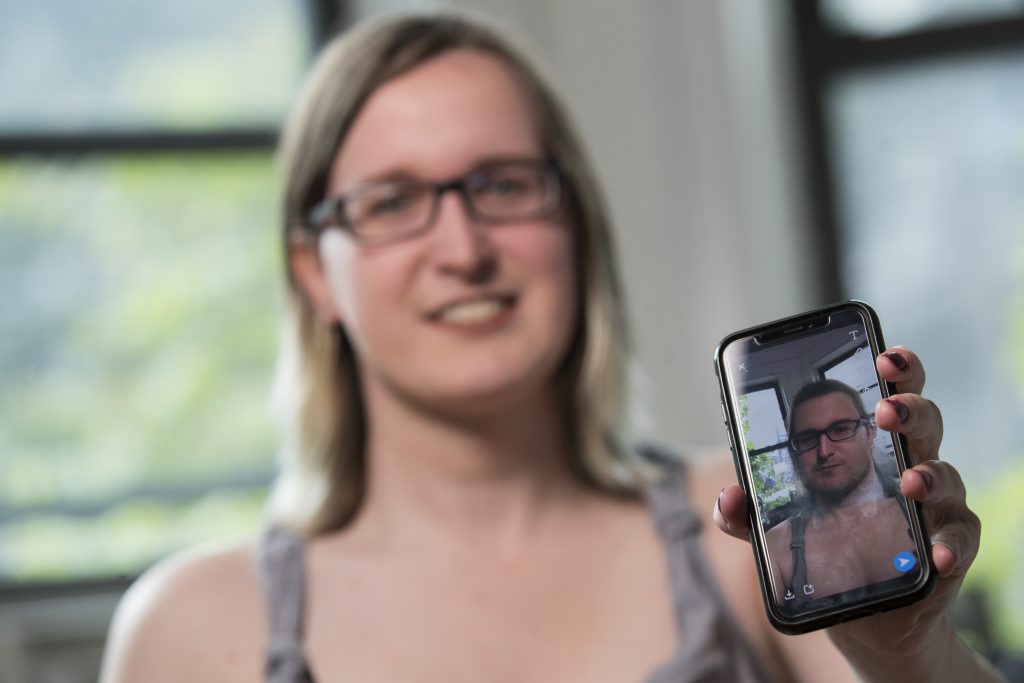 Snapchat Gender Swap In this Wednesday, May 15, 2019, photo, Bailey Coffman shows her photo as a man in the Snapchat app during an interview in New York. Snapchat's new photo filter that allows users to change into a man or woman with the tap of a finger isn’t necessarily fun and games for transgender people. But some others see the potential for such tools to lead to self-discovery among people struggling with their gender identity. (Mary Altaffer/AP Photo)