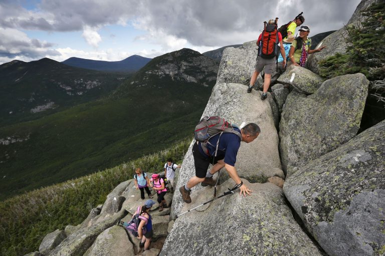 Day-hikers scramble over rocky boulders on the Appalachian Trail below the summit of Mt. Katahdin in Baxter State Park in Maine. (Robert F. Bukaty/AP Photo)