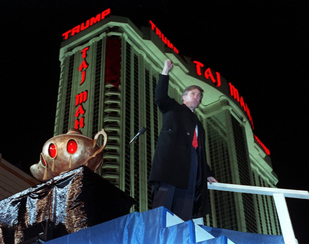 Donald Trump and Taj Mahal Donald Trump ascends the stairs with his fist raised from the genie's lamp after opening the Trump Taj Mahal Casino Resort in a spectacular show of fireworks and laser lights Thursday evening in Atlantic City, N.J., on April 5, 1990. Behind Trump is the 42-story hotel. (AP Photo/Chaarles Rex Arbogast)