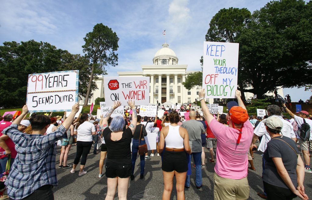 Abortion Alabama Protesters for women's rights hold a rally on the Alabama Capitol steps to protest a law passed last week making abortion a felony in nearly all cases with no exceptions for cases of rape or incest, Sunday, May 19, 2019, in Montgomery, Ala. (AP Photo/Butch Dill)
