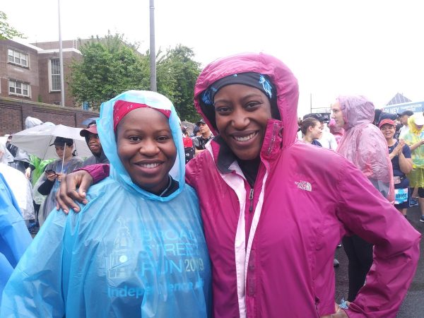 Lorpu Jones (left), came from New York City while her sister Shyloe Jones (right), came from Washington, D.C. to participate in the Broad Street Run together. (Ximena Conde/WHYY)