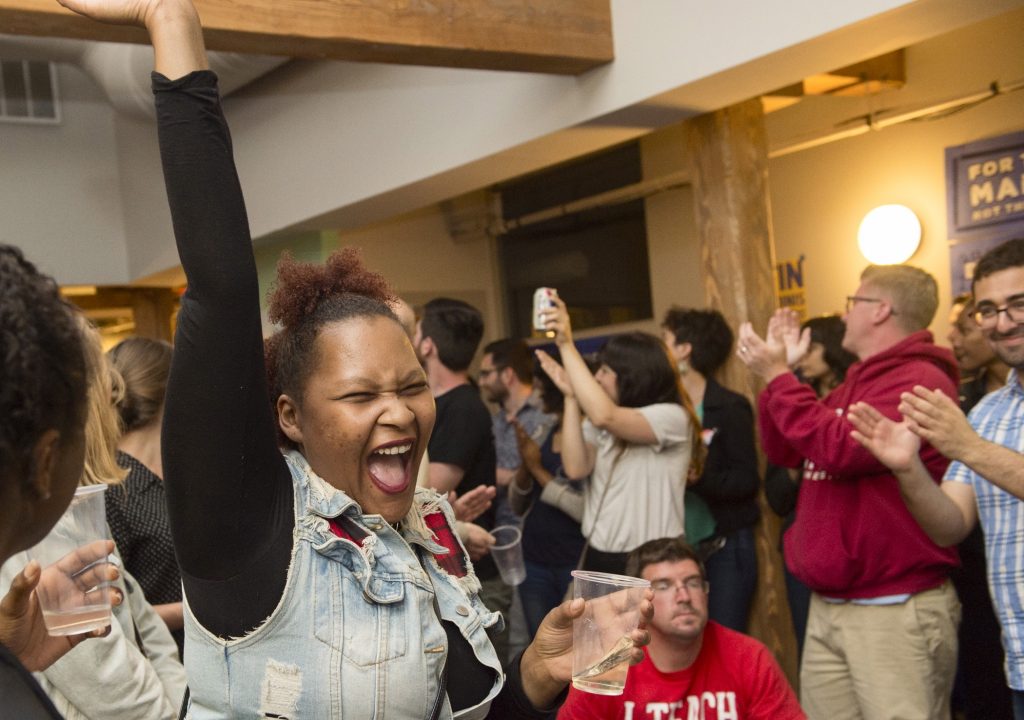 ELECTION PARTY 2019 Robin Richardson cheers during an election party held at Reclaim Philadelphia and 215 People's Alliance headquarters on election night. (Jonathan Wilson for WHYY)