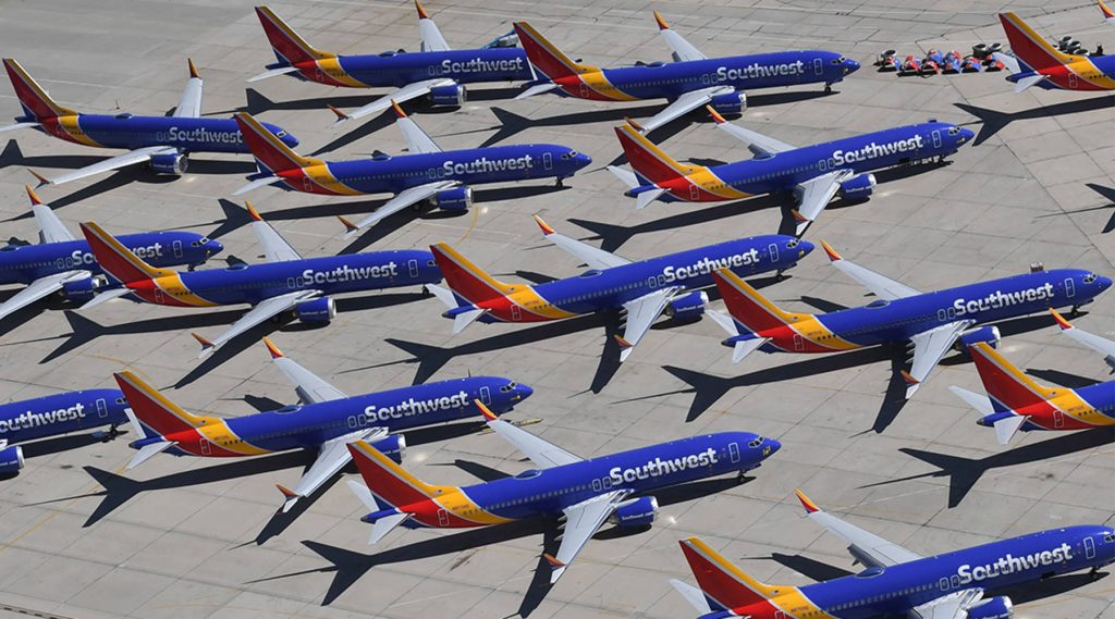 TOPSHOT-US-AVIATION-BOEING Southwest Airlines Boeing 737 Max airplanes are parked on the tarmac after being grounded at the Southern California Logistics Airport in Victorville on March 28. (Mark Ralston/AFP/Getty Images)