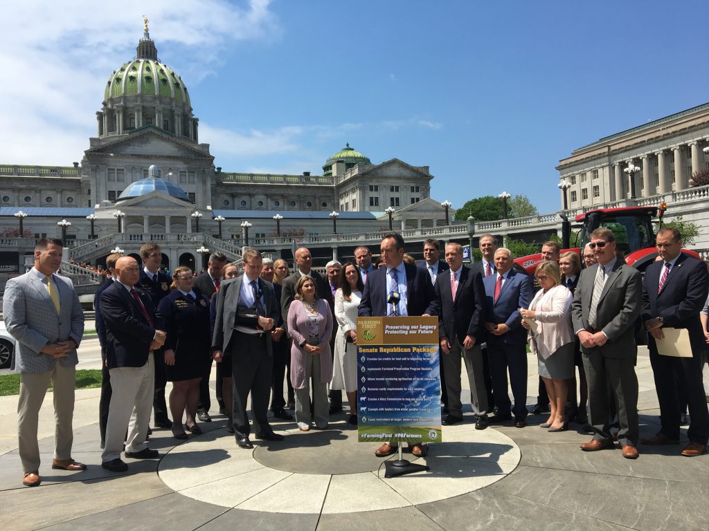 A group of state Senators touts passage of a package of bills aimed at helping farmers. (Katie Meyer/WITF)