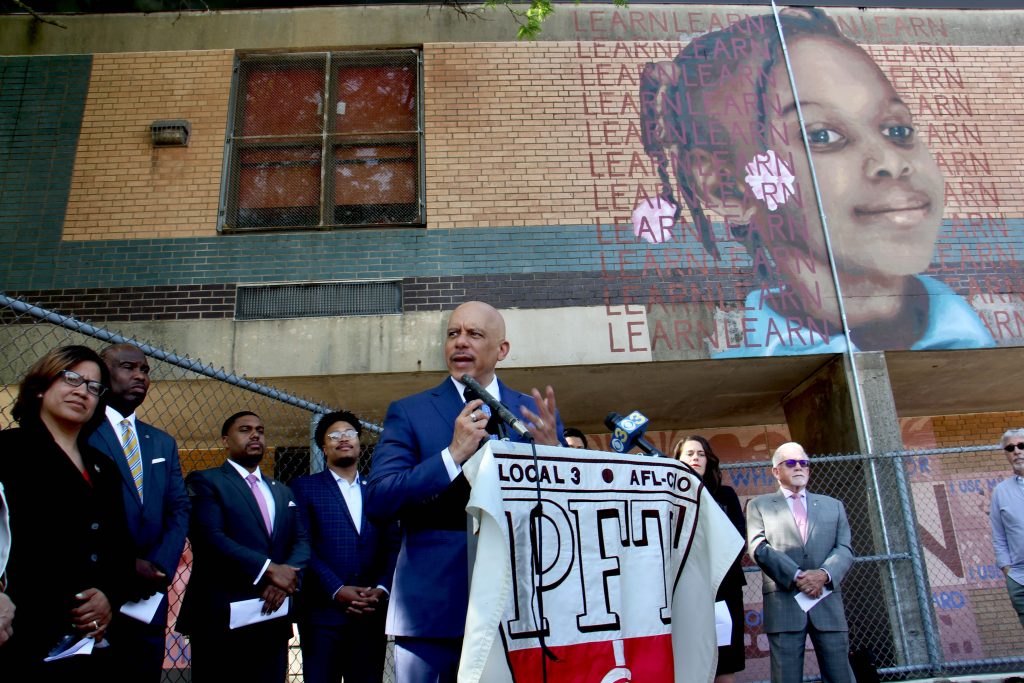 Image uploaded from iOS State Sen. Vincent Hughes announces proposed legislation that would allocate surplus state funds to emergency school repairs, largely in Philadelphia. (Emma Lee/WHYY)