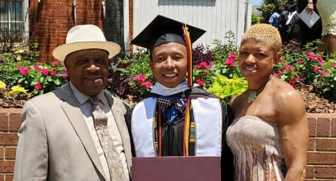 Morehouse grad Ahmad Smith, flanked by his father, Wayne, and his sister Chanel, had $110,000 in student loans wiped clean. (Courtesy of Chanel Smith)