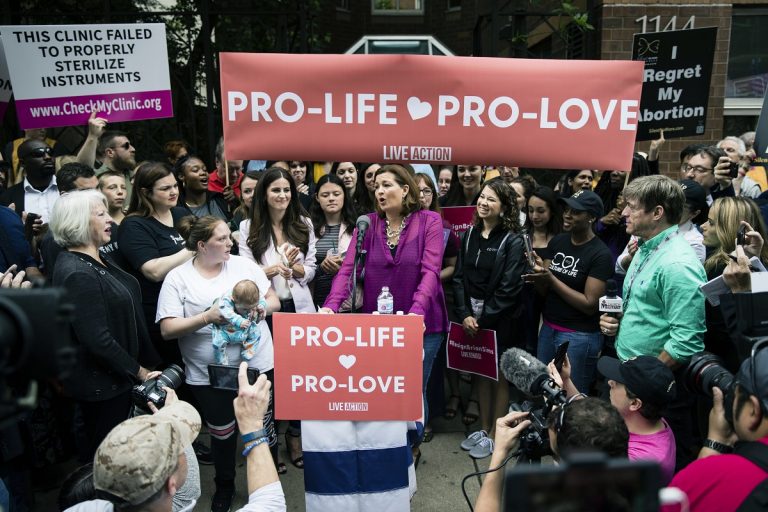 Ashley Garecht speaks as anti-abortion protesters rally near a Planned Parenthood clinic in Philadelphia, Friday, May 10, 2019. The demonstration was spurred by the actions of a Democratic state lawmaker who recorded himself berating an anti-abortion demonstrator at length outside the clinic. (AP Photo/Matt Rourke)