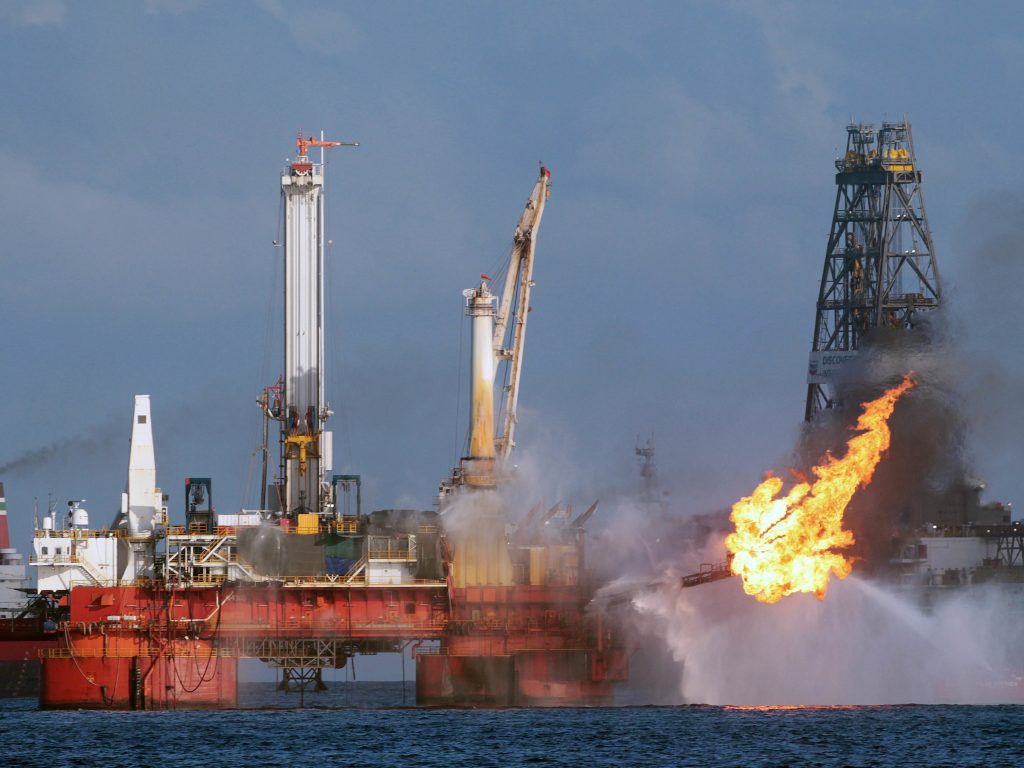 The Deepwater Horizon oil rig is seen here in July 2010, shortly before the Macondo well was capped after spilling oil for 87 days. The Trump administration has proposed revisions to Obama-era rules that aimed to prevent similar disasters. (Dave Martin/Associated Press)