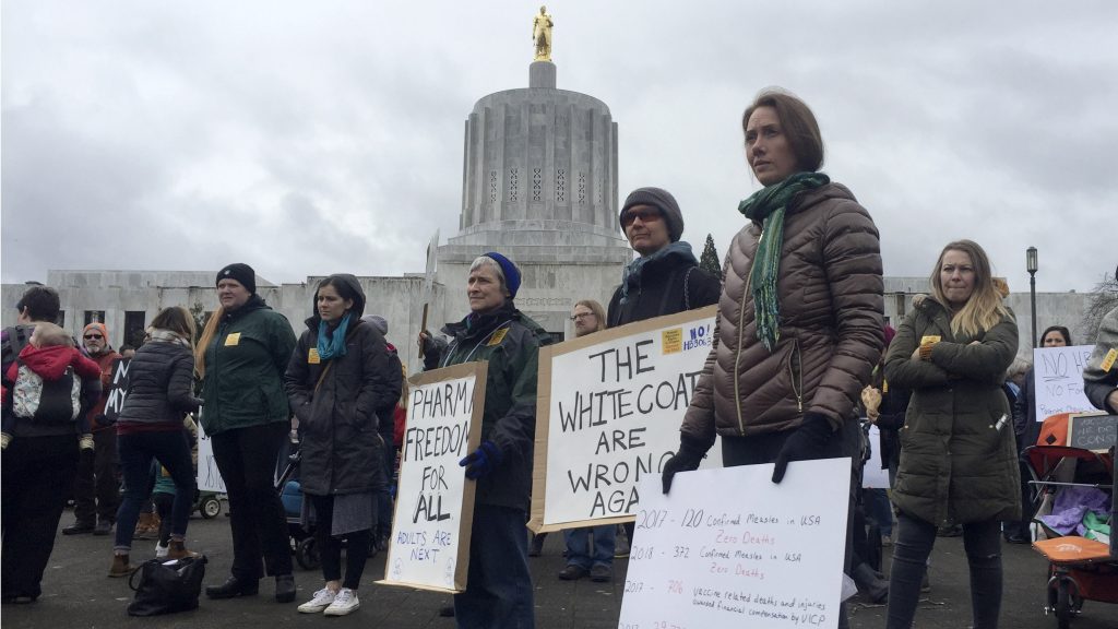 Hundreds of people rally in March at the Oregon State Capitol in Salem, protesting a proposal to tighten school vaccine requirements Similar rallies were held in April. Hundreds of people rally in March at the Oregon State Capitol in Salem, protesting a proposal to tighten school vaccine requirements Similar rallies were held in April (Sarah Zimmerman/AP)