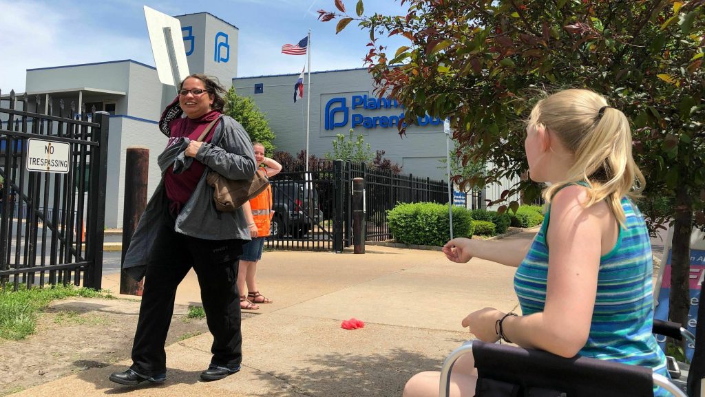 Teresa Pettis (right), an abortion opponent, protests outside the Planned Parenthood clinic in St. Louis, on May 17. Unless a judge intervenes, health officials will force a Missouri facility to stop offering the procedure this week. Teresa Pettis (right), an abortion opponent, protests outside the Planned Parenthood clinic in St. Louis, on May 17. Unless a judge intervenes, health officials will force a Missouri facility to stop offering the procedure this week. (Jim Salter/AP)