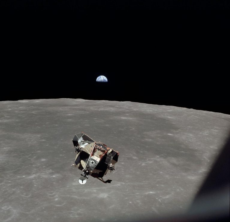 The Apollo 11 Lunar Module ascent stage in lunar orbit in 1969 with with astronauts Neil Armstrong and Buzz Aldrin aboard. The Earth rises above the lunar horizon. (Photo credit: NASA)