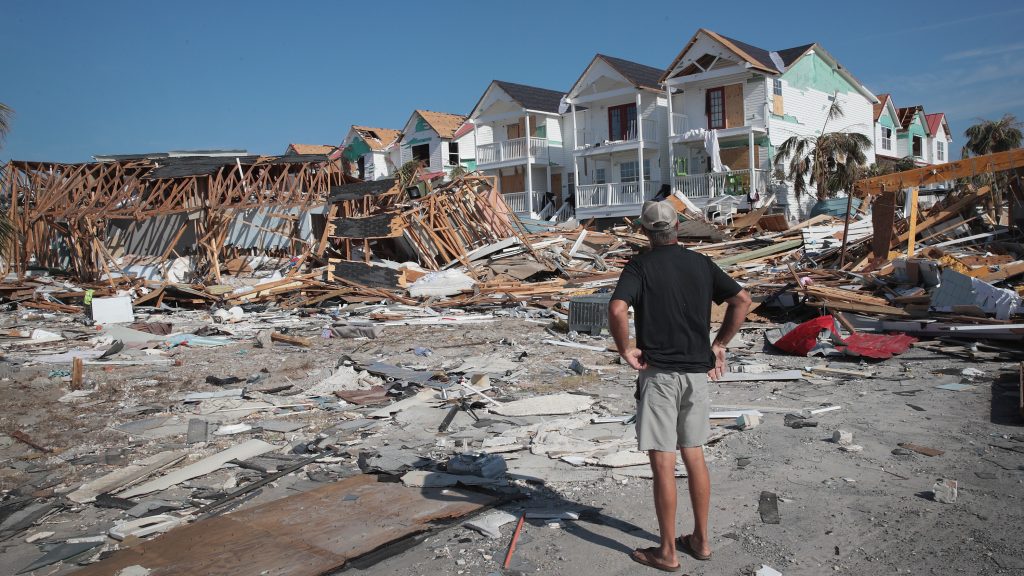 A resident of Mexico Beach, Fla., looks over damage caused to the Florida Panhandle by Hurricane Michael in October 2018. A resident of Mexico Beach, Fla., looks over damage caused to the Florida panhandle by Hurricane Michael in October 2018. (Scott Olson/Getty Images)