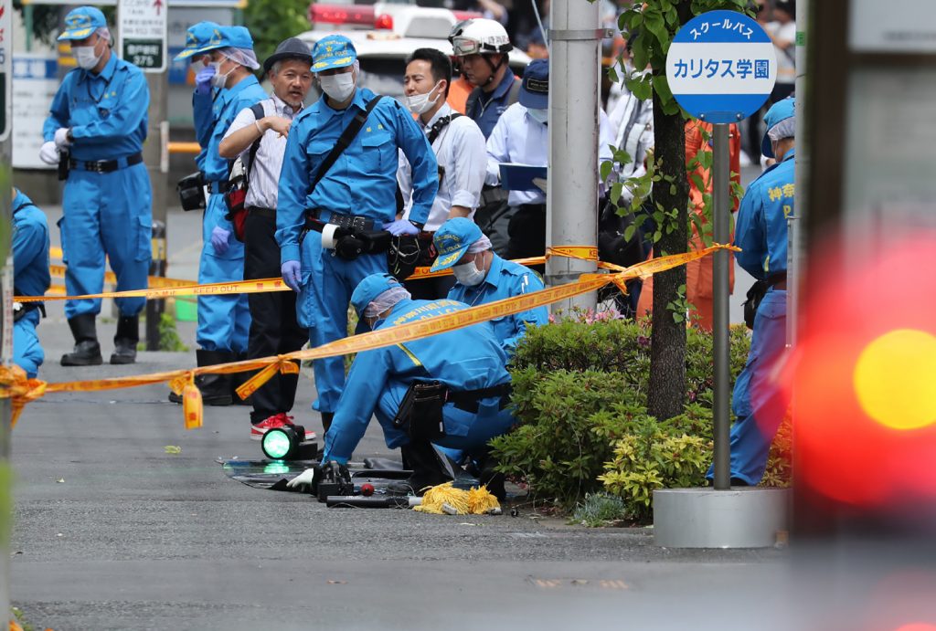 Police forensic experts investigate a crime scene where a man stabbed 19 people, including children in Kawasaki on May 28. Two people, including a child, are reportedly dead. Police forensic experts investigate a crime scene where a man stabbed 19 people, including children in Kawasaki on May 28. Two people, including a child, are reportedly dead.