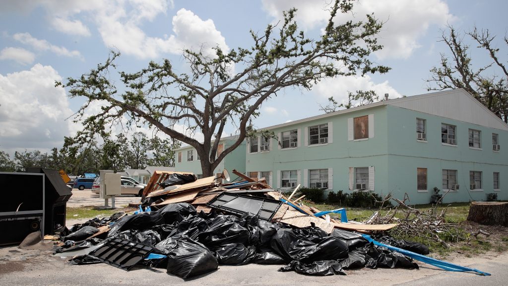 Debris is piled outside an apartment complex that was damaged by Hurricane Michael on May 10 in Panama City, Fla. Rep. Chip Roy objected to a procedural vote on a bipartisan $19.1 billion disaster aid bill, forcing Congress to wait until June to finish work on the legislation. (Scott Olson/Getty Images)
