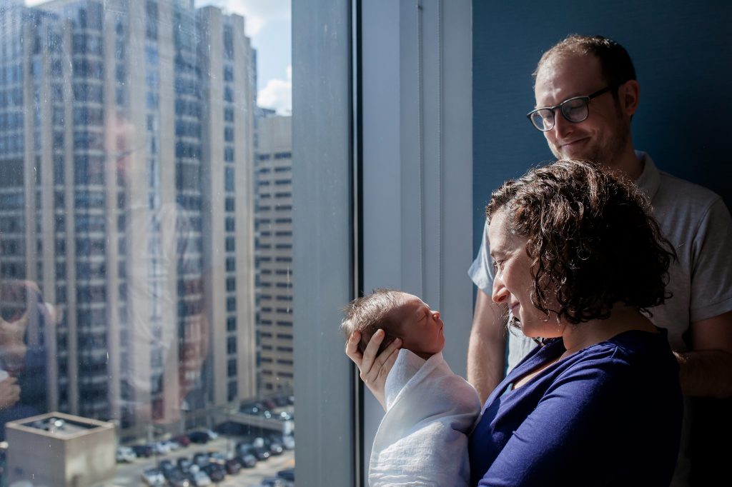 Reporter Jenny Gold and her husband, Alex Gourse, with their newborn son at Prentice Women's Hospital in Chicago two days after his birth. (Courtesy of Bella Baby Photography)