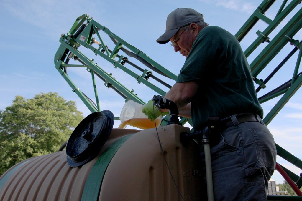 John Draper pours glyphosate into the tank of his sprayer at the University of Maryland’s Wye Research and Education Center. John Draper pours glyphosate into the tank of his sprayer at the University of Maryland's Wye Research and Education Center. (Dan Charles/NPR)