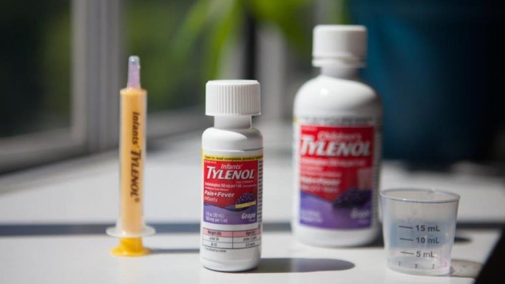 Infants' Tylenol comes with a dosing syringe, while Children's Tylenol has a plastic cup. Both contain the same concentration of the active ingredient, acetaminophen. (Ryan Kellman/NPR)