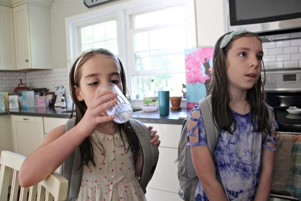 2019 05 17-e lee-emily cutaiar jodi cutaiar-sellersville-pfas contamination well water Emily Cutaiar, 8, (left) and her sister Jessica, 9, know not to drink water from the tap in their Sellersville home. Their well was found to be contaminated with PFAS. (Emma Lee/WHYY)