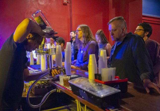 Troc fans line up at the bar prior to show time. (Jonathan Wilson for WHYY)