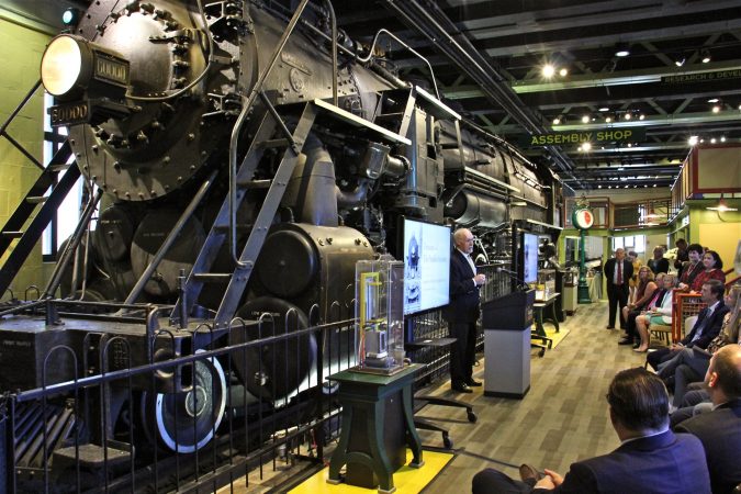 Donald E. Morel, Jr., chairman of the board of trustees of the Franklin Institute, announces that a $6 million gift from the Hamilton Family Charitable Trust will transfrom the iconic Train Factory exhibit into a an open curatorial space. (Emma Lee/WHYY)