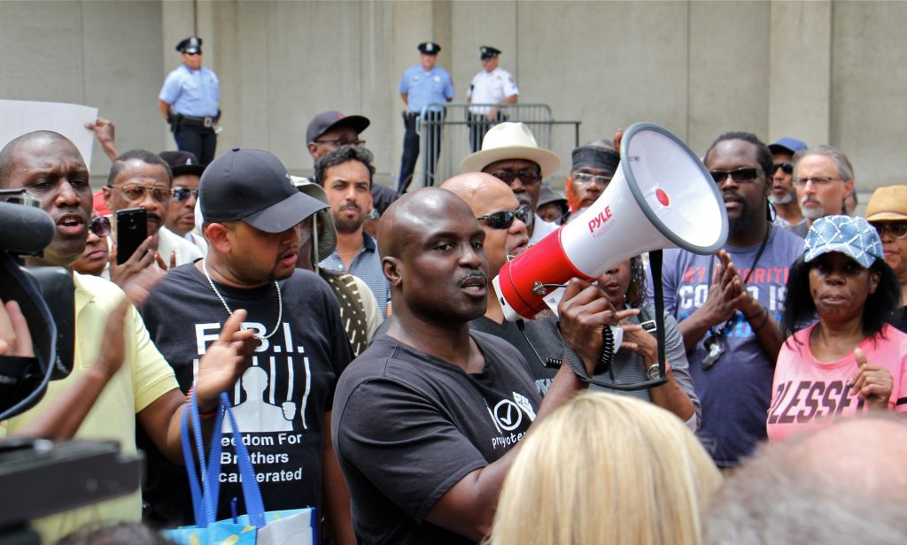 2019 06 07-e lee-solomon jones-philadelphia police headquarters-rallly protest against racist facebook posts Columnist and commentator Solomon Jones leads a rally at Philadelphia police headquarters to call for action against police officers who posted racist comments on Facebook. (Emma Lee/WHYY)