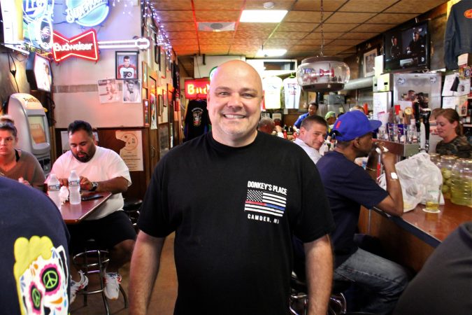 Donkey's Place owner Rob Lucas serves the Friday lunch crowd. His grandfather started the restaurant in Camden 76 years ago. (Emma lee/WHYY)
