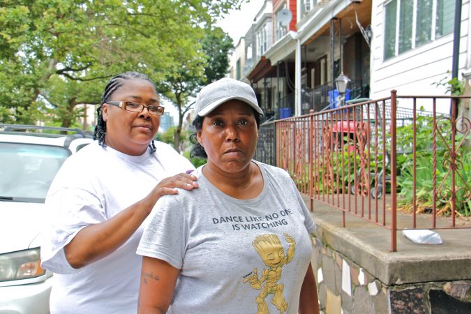 Kilynn Johnson (left) and Sonya Sanders, residents of South 32nd Street, are members of Philly Thrive, an organizations that opposes the expansion of Philadelphia Energy Solutions and blames the refinery for many of the neighborhood's health problems. (Emma Lee/WHYY)